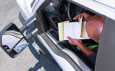 spare tires and automotive mechanic tools lay on roadside